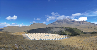 The complete array of HAWC detector tanks is seen here in Dec. 2014. Image: HAWC Collaboration (Click image to download hi-res version.)