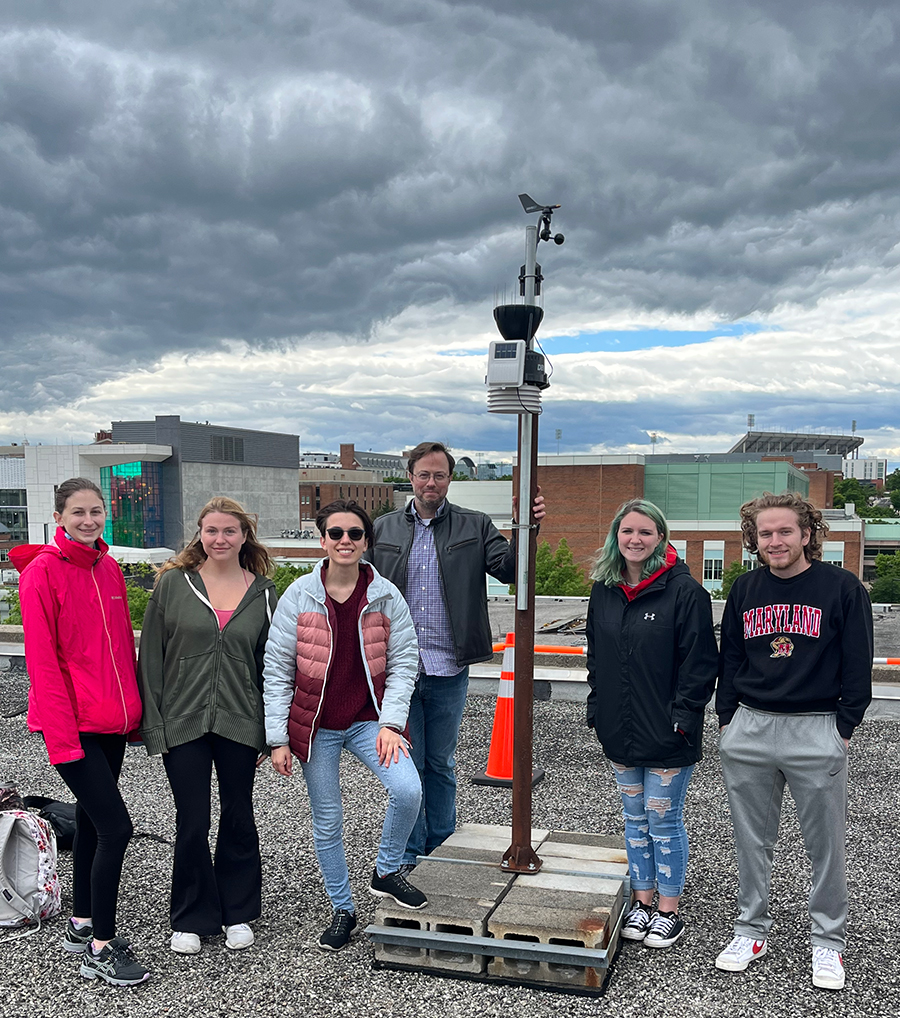 The Mesoterps pose in front of a weather station