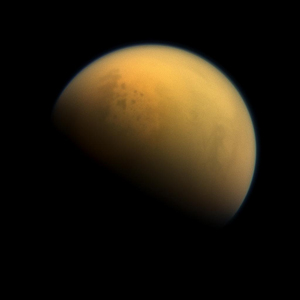 A new research paper describes a period more than 2.4 billion years ago, when Earth’s atmosphere was filled with a thick, methane-rich haze much like Saturn’s moon Titan, seen here in an image taken by NASA’s Cassini spacecraft in 2013. Image credit: NASA/JPL-Caltech/Space Science Institute (Click image to download hi-res version.)