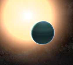 The atmosphere of the distant “warm Neptune” HAT-P-26b, illustrated here, is unexpectedly primitive, composed primarily of hydrogen and helium. By combining observations from NASA’s Hubble and Spitzer space telescopes, researchers determined that, unlike Neptune and Uranus, the exoplanet has relatively low metallicity—an indication of the how rich the planet is in all elements heavier than hydrogen and helium. Image credit: NASA/GSFC (Click image to download hi-res version.)