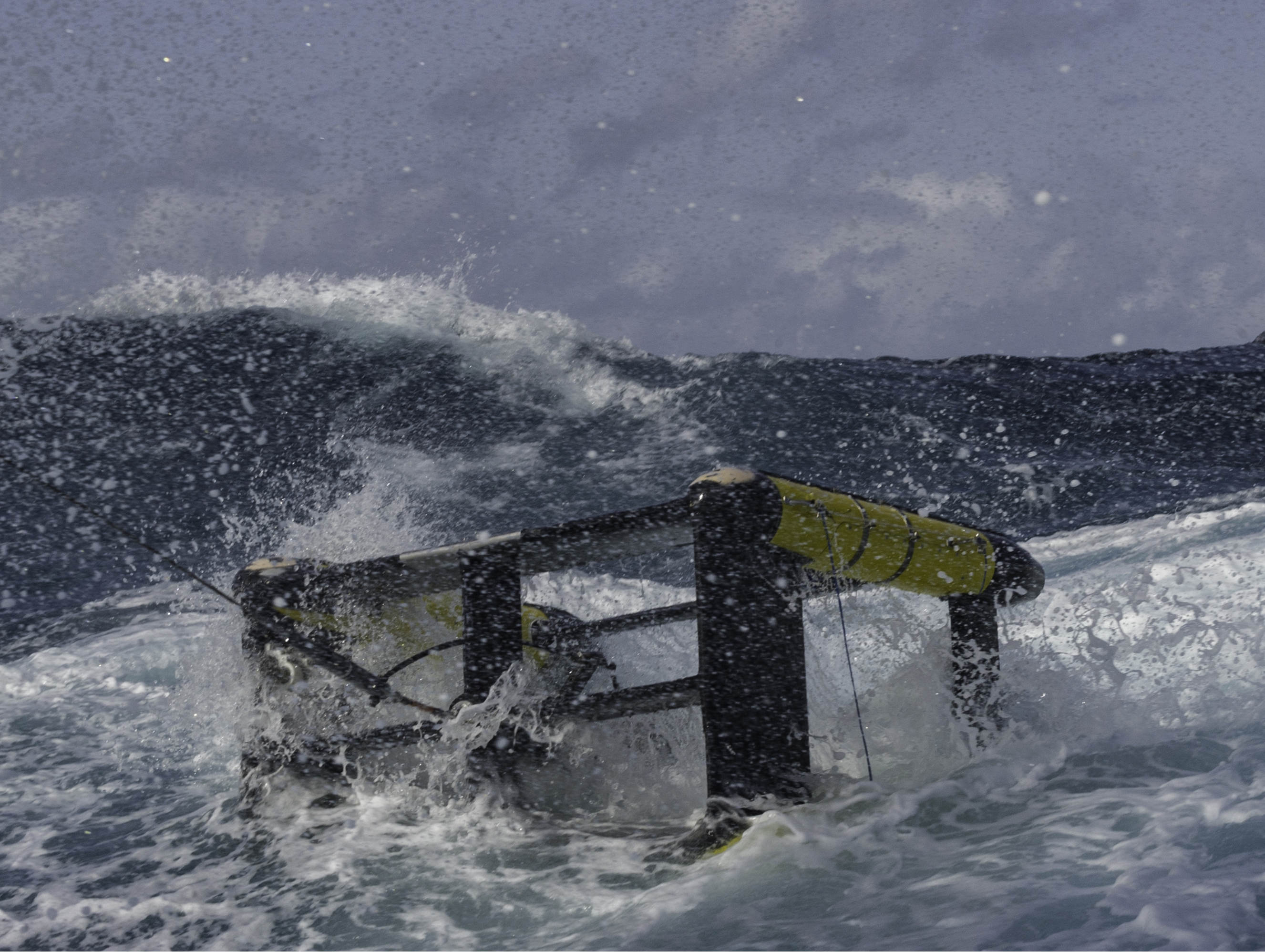 The “Triaxus” towing platform breaks through the choppy surface of the ocean during a storm. By towing such a platform with monitoring instruments through the water, changing its depth in a 'yo-yo' pattern as it traveled, scientists created high-resolution snapshots of how a dye released upstream evolved across the Gulf Stream front. Photo credit Craig M. Lee, UW APL. Click image to download hi-res version.