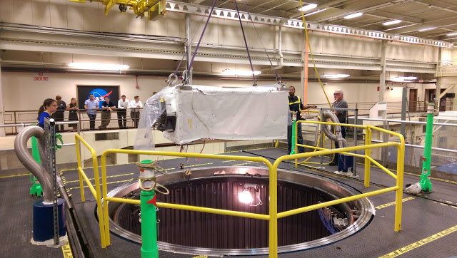 Technicians lower ISS-CREAM into a chamber that simulates the space environment during system-level testing at NASA's Goddard Space Flight Center in summer 2015. Image credit: University of Maryland Cosmic Ray Physics Laboratory (Click image to download hi-res version.)