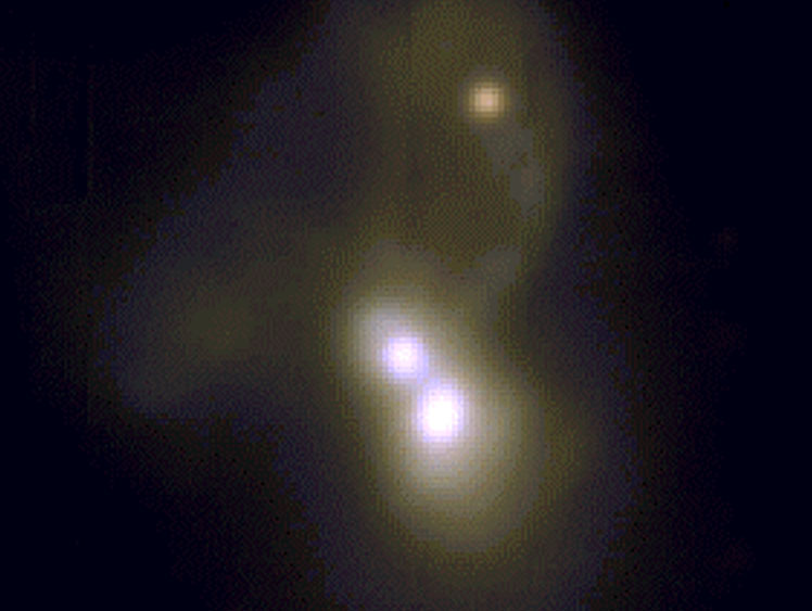 A triple galaxy merger with potentially two active galactic nuclei provides a rare glimpse into multiple processes. Image Credit: VLT/MUSE R-V-B composite image
